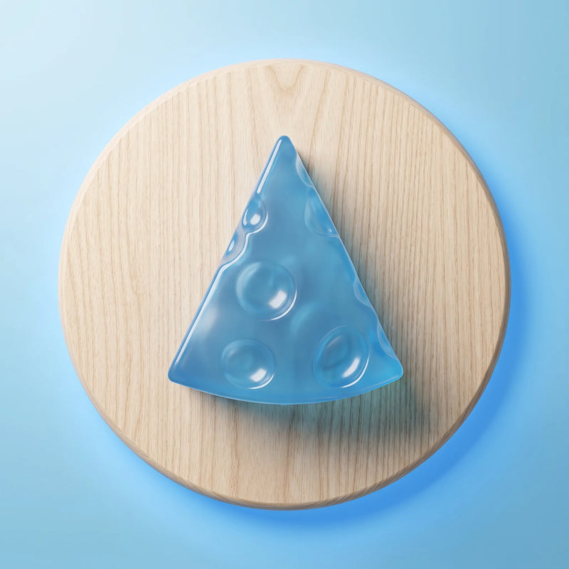 Translucent ice blue cheese squishy wedge photographed against a plain backdrop