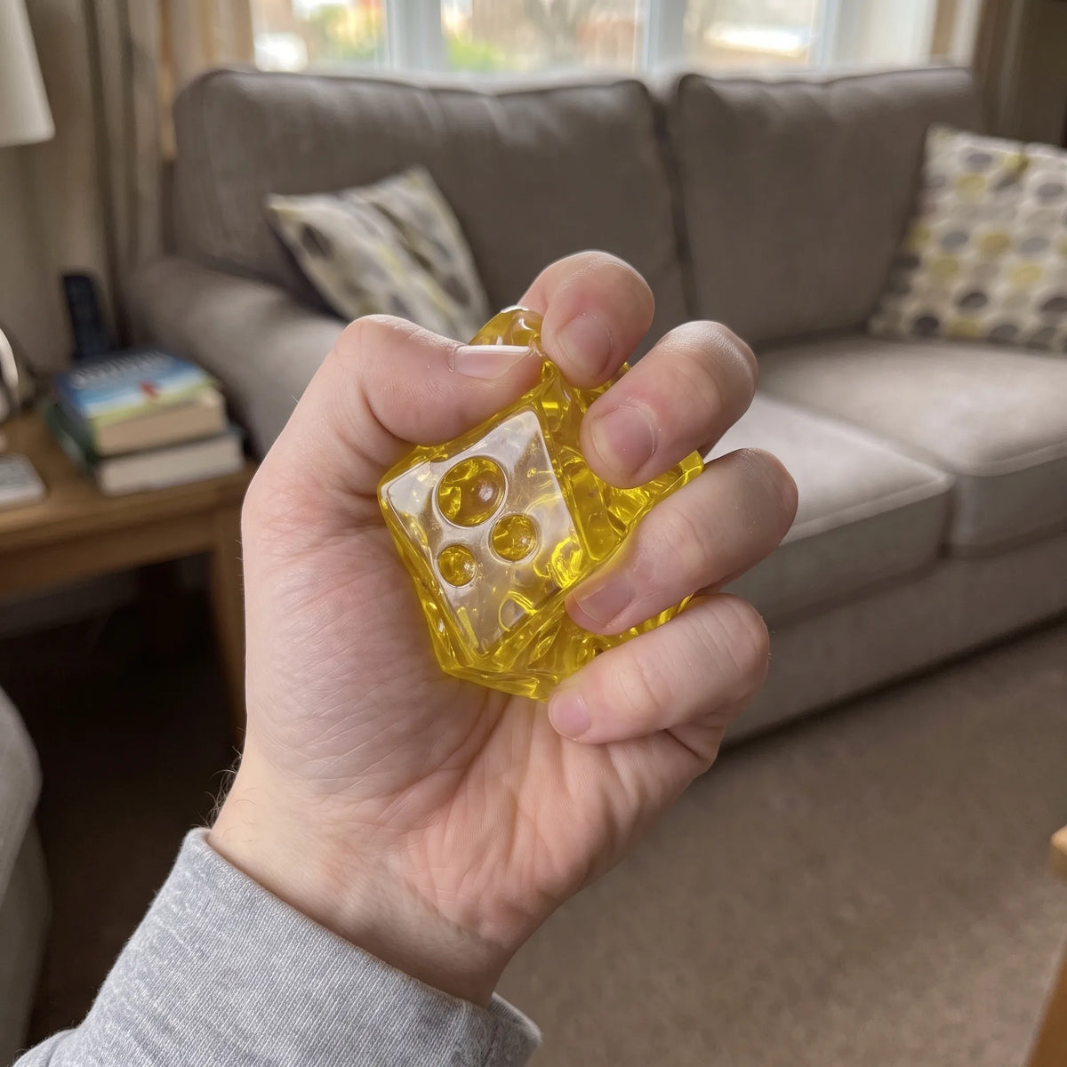 Hand pressing the clear cheese squishy block flat
