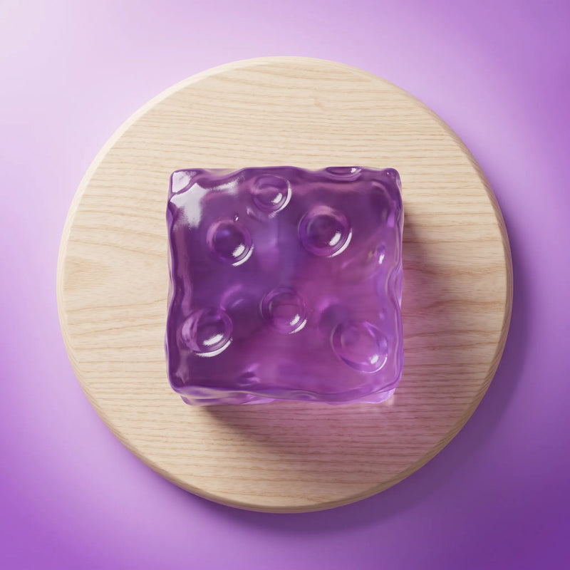 Violet cheese squishy cube styled in a soft home setting