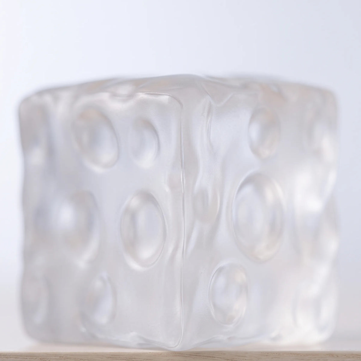 Macro view of light passing through the clear cheese squishy cube