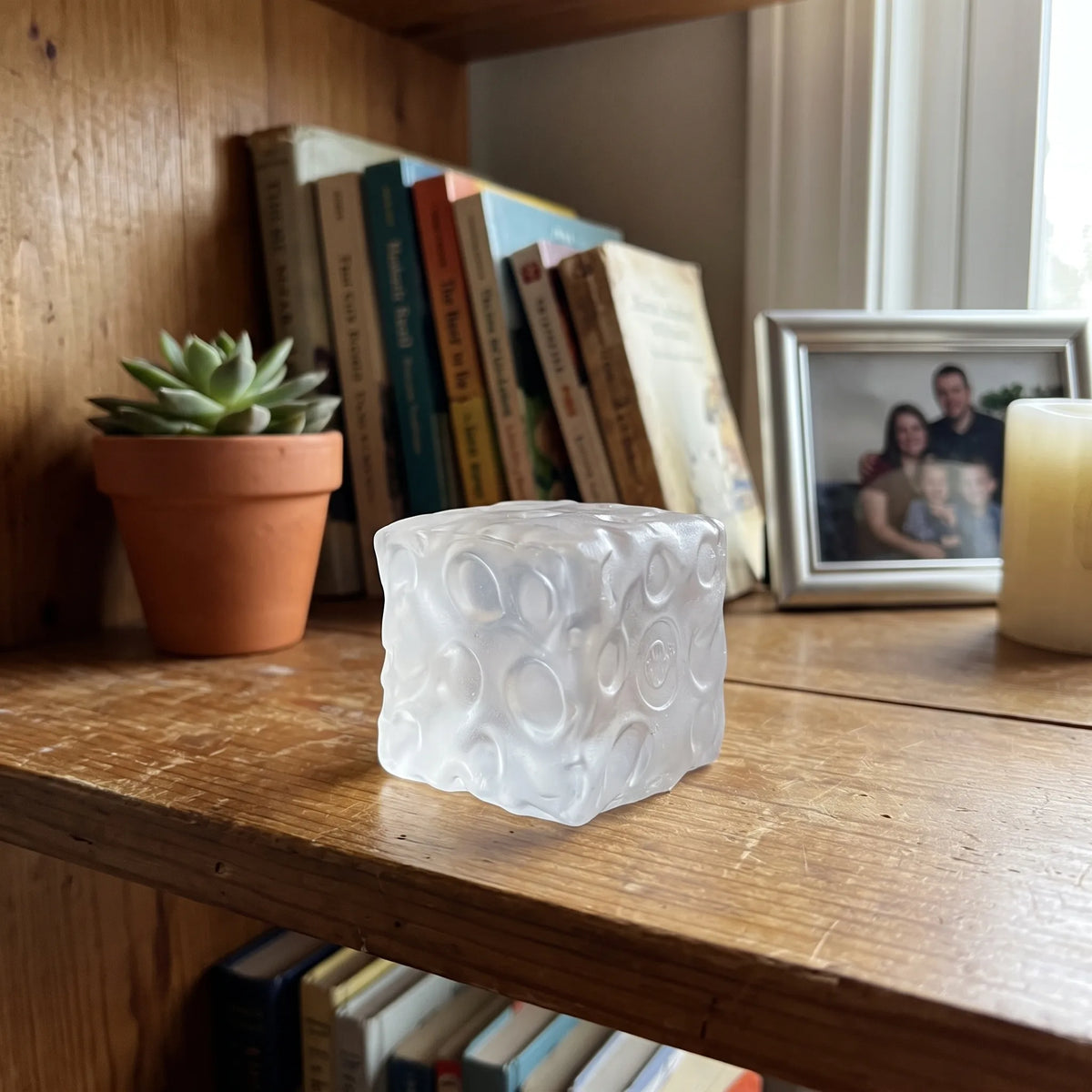 Clear white cheese squishy cube in a bright home setting