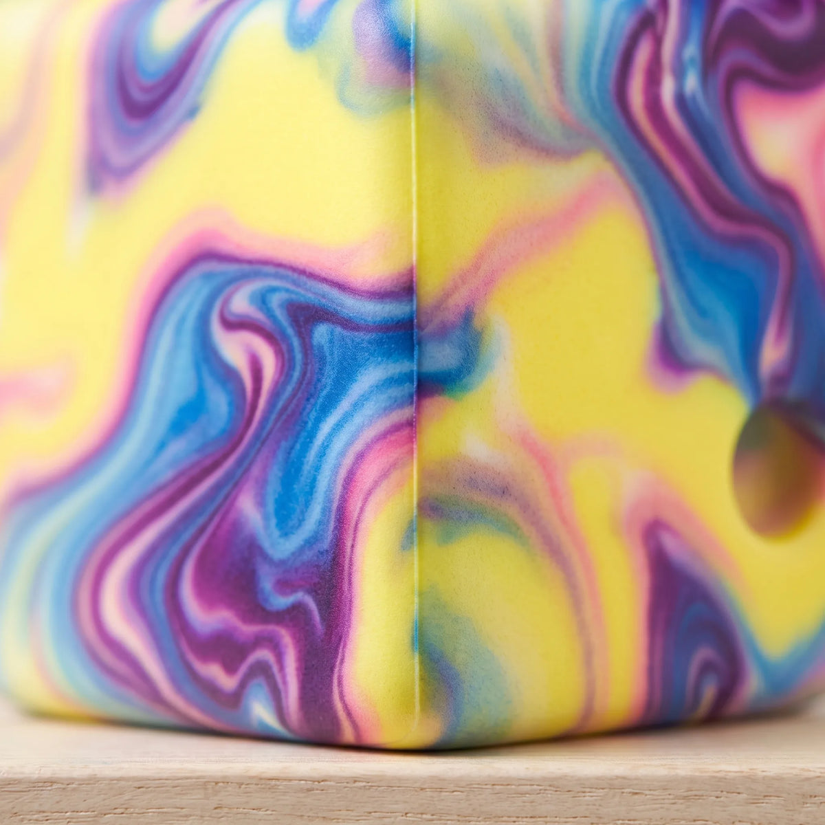 Close-up of the marbled swirl on the purple cheese squishy block