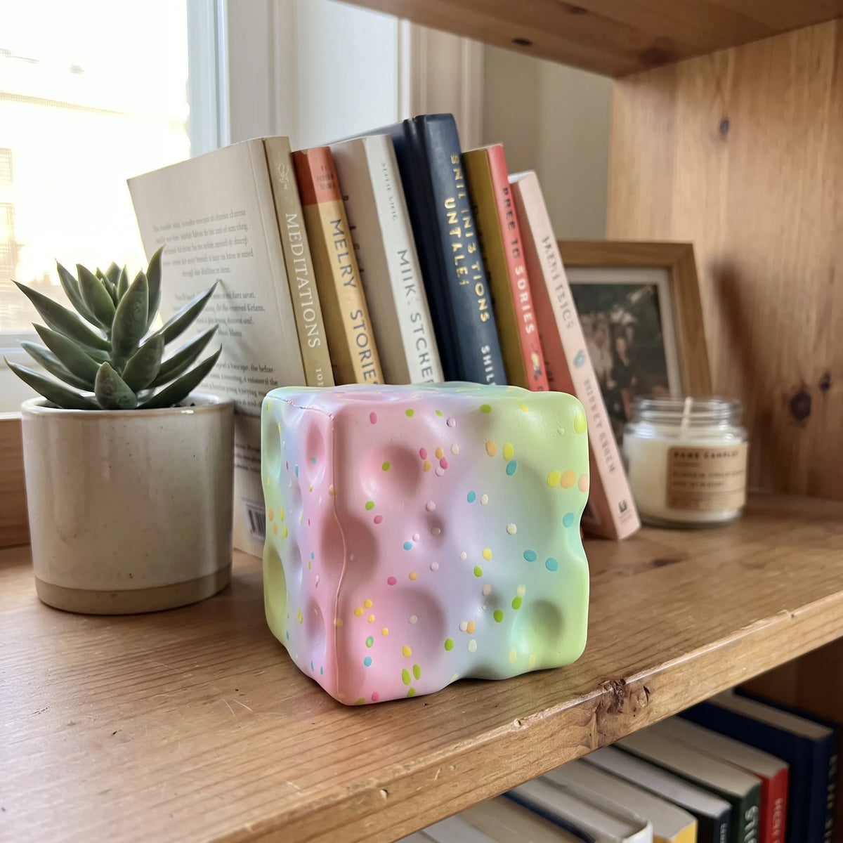Sweet style cheese squishy block styled among pastel accessories